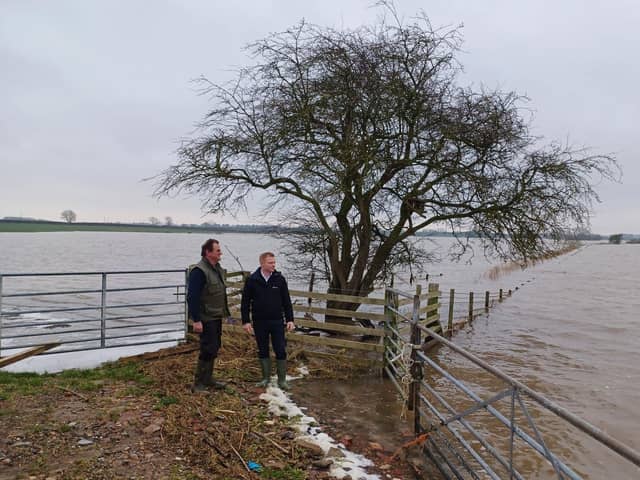 Farmer Nigel Watson and Robbie Moore MP survey flood damage to farmland in East Yorkshire.