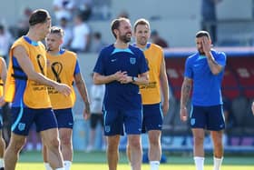 READY, WILLINAG AND ABLE: England's Harry Kane and manager Gareth Southgate during a training session at the Al Wakrah Sports Complex in Qatar. Picture: Martin Rickett/PA