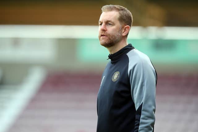 NORTHAMPTON, ENGLAND - APRIL 18: Harrogate Town manager Simon Weaver looks on during the Sky Bet League Two match between Northampton Town and Harrogate Town at Sixfields on April 18, 2022 in Northampton, England. (Photo by Pete Norton/Getty Images)