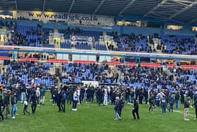 ANGER: Reading fans invade the pitch 16 minutes into Saturday's game against Port Vale