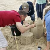 Mark Lewis, who creates incredible sand sculptures loves "bringing a smile to peoples faces" Hogwarts under construction.