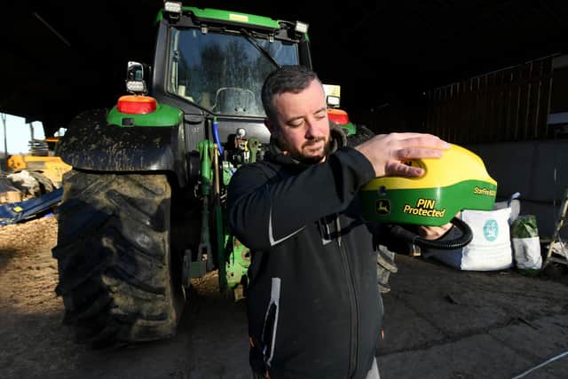 Lee Turner is pictured with a GPS System at a  farm near Hovingham