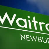 File photo dated 18/03/14 of a sign for a Waitrose supermarket, as Waitrose has admitted to signing deals with landlords halting other supermarkets from opening nearby for a decade, following a probe by the UK competition watchdog.