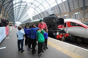 Author Michael Morpurgo gives a reading to school children on Platform 8 at King's Cross Station in London at the launch of the Flying Scotsman's centenary campaign. Photo: James Manning/PA