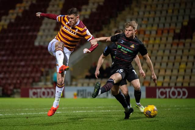 Andy Cook fires in an early shot for Bradford City versus Doncaster Rovers.  The striker's night ended on a sour note after being sent off for two yellow cards in the second half. Picture: Bruce Rollinson,