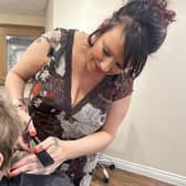 Rebecca Roberts is offering free hair cuts to families who can't afford them