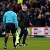 Sheffield United manager Chris Wilder speaks with referee Sunny Singh Gill at half-time during the Emirates FA Cup fourth-round match against Brighton at Bramall Lane. Picture: Martin Rickett/PA Wire..