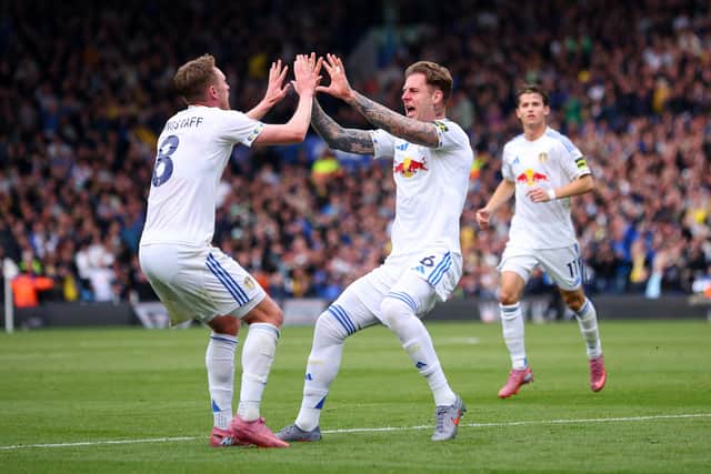 LEEDS, ENGLAND - SEPTEMBER 27: Joe Rodon of Leeds United celebrates scoring his team's first goal with teammate Sean Longstaff during the Premier League match between Leeds United and Bournemouth at Elland Road on September 27, 2025 in Leeds, England. (Photo by Ed Sykes/Getty Images)