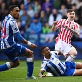 Stoke City substitute Luke Cundle fires home a 76th-minute equaliser, despite the best efforts of Sheffield Wednesday rival Liam Palmer, who had fired the hosts in front eight minutes earlier in a key Championship relegation six-pointer at Hillsborough. Photo by Ben Roberts Photo/Getty Images.