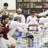 Worshipers share food following Eid prayer, which marks the end of Ramadan and the start of Eid, at Leeds Grand Mosque. PIC: PA.