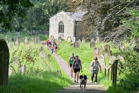 Walkers passing the church at Hawnby, part of the new Upper Ryedale Parish Trail