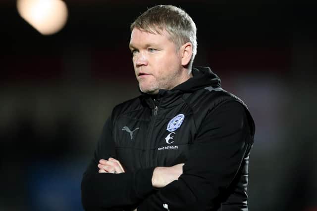 SALFORD, ENGLAND - NOVEMBER 16: Grant McCann, Manager of Peterborough United looks on during the Emirates FA Cup First Round Replay match between Salford City and Peterborough United at Peninsula Stadium on November 16, 2022 in Salford, England. (Photo by Charlotte Tattersall/Getty Images)