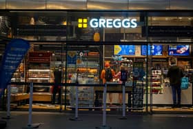 People purchase food in a branch of the bakery chain Greggs inside London Bridge station on November 14, 2020.  (Photo by NIKLAS HALLE'N/AFP via Getty Images)