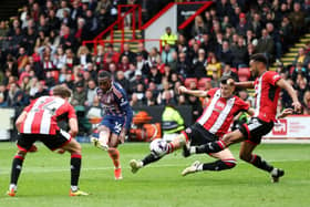 TOUGH DAY: Nottingham Forest's Callum Hudson-Odoi scores his team's third goal against Sheffield United at Bramall Lane Picture: George Wood/Getty Images