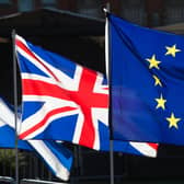 Union and European Union flags flying together. PIC: PA
