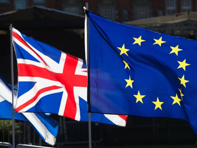 Union and European Union flags flying together. PIC: PA