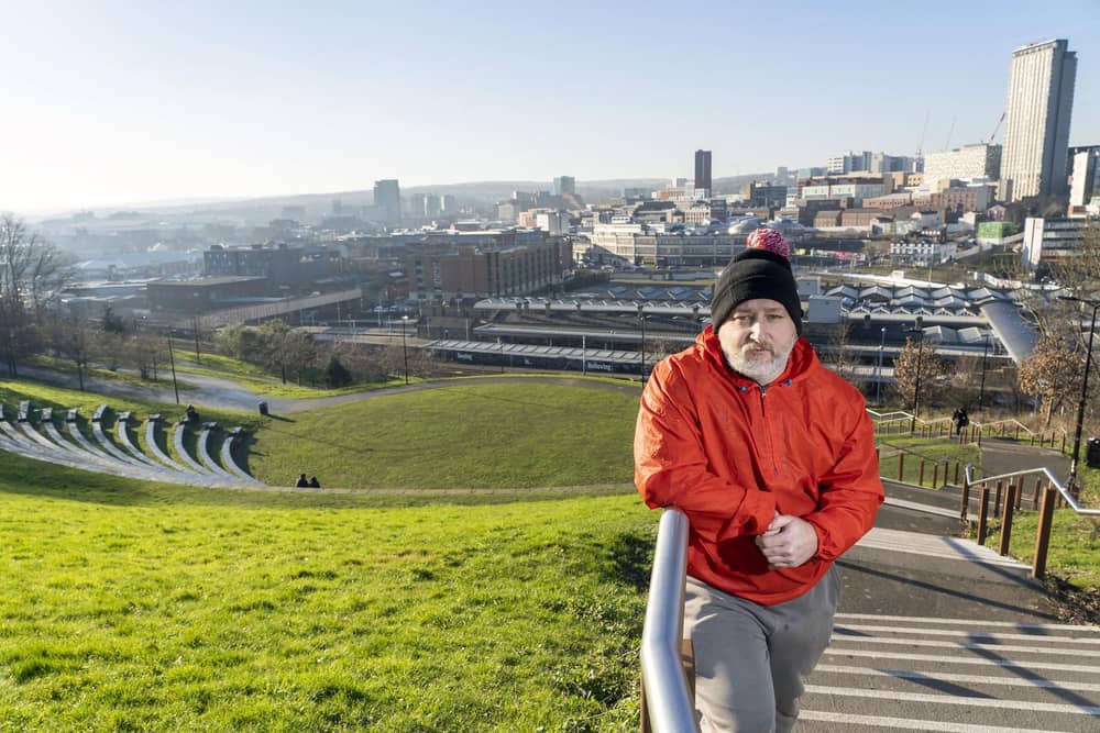 Former homeless man Chris Royston at the stteel steps behind Sheffield train station. Picture Scott Merrylees