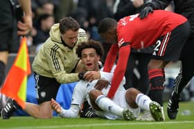 FEISTY: Arguments rage between Tyrell Malacia and Tyler Adams even as the bloodied Leeds United midfielder receives treatment