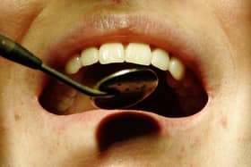 A patient having their teeth examined while sitting in a dentist's chair, as the number of "dental deserts" is growing across England, according to a new analysis.