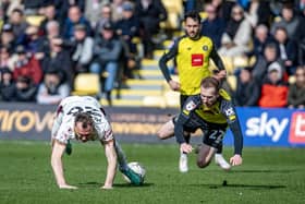 DERBY DUEL: Bradford City's Kevin McDonald  and Harrogate Town's Stephen Dooley battle in last Saturday's Yorkshire derby at the EnviroVent Stadium Picture: Tony Johnson