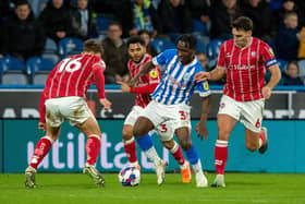 OUTNUMBERED: Huddersfield Town's Brahima Diarra is crowded out