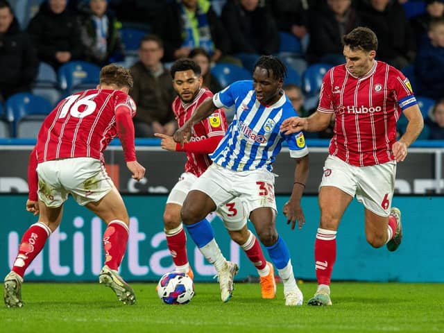 OUTNUMBERED: Huddersfield Town's Brahima Diarra is crowded out