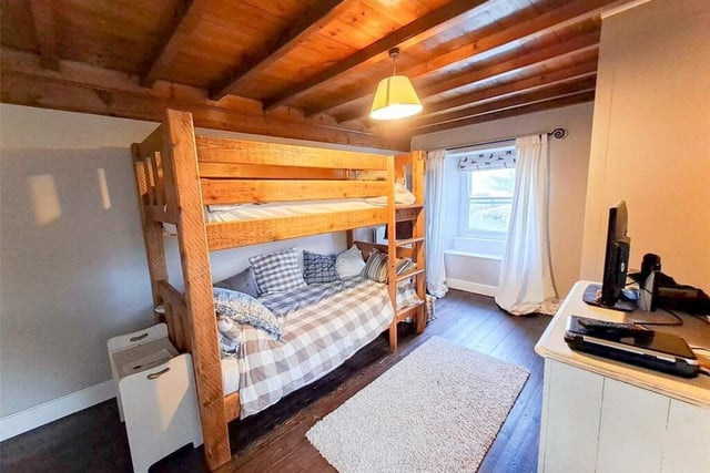 This bedroom has bunk beds but could easily take a double bed instead