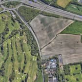 A aerial view of the proposed Amazon warehouse site at Scholes, near Cleckheaton, showing its proximity to local houses. It is bordered by the M62 on one side, a cemetery, Whitechapel Road and Whitehall Road. (Image: Google)