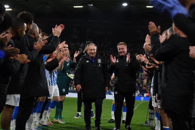GUARD OF HONOUR: Huddersfield Town manager Neil Warnock (left) and his assistant Ronnie Jepson leave the field
