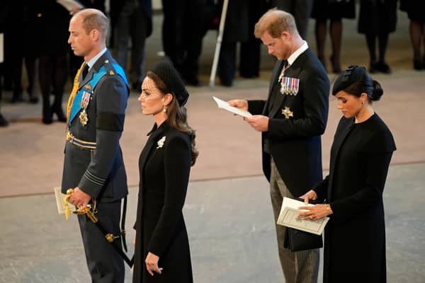 The Prince and Princess of Wales and the Duke and Duchess of Sussex pay their respects as the coffin of Queen Elizabeth II, draped in the Royal Standard with the Imperial State Crown placed on top, lies on the catafalque and will lie in state ahead of her funeral on Monday. Picture date: Wednesday September 14, 2022.
