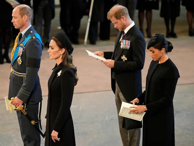 The Prince and Princess of Wales and the Duke and Duchess of Sussex pay their respects as the coffin of Queen Elizabeth II, draped in the Royal Standard with the Imperial State Crown placed on top, lies on the catafalque and will lie in state ahead of her funeral on Monday. Picture date: Wednesday September 14, 2022.