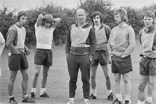 English footballer Bobby Charlton (centre), manager of League Division Two team Preston North End FC, at the start of the 1973-74 football season, a year in which he went up against his brother in the dugout (Picture: Evening Standard/Hulton Archive/Getty Images)