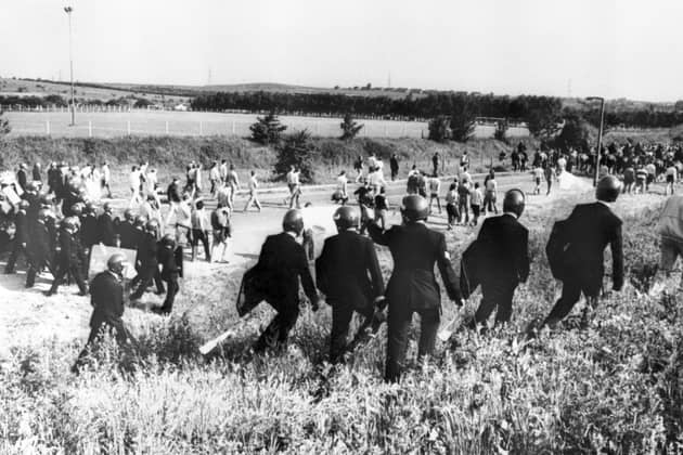 Police in anti-riot gear escorting picketers away from their position near the Orgreave Coking Plant. PIC: PA/PA Wire