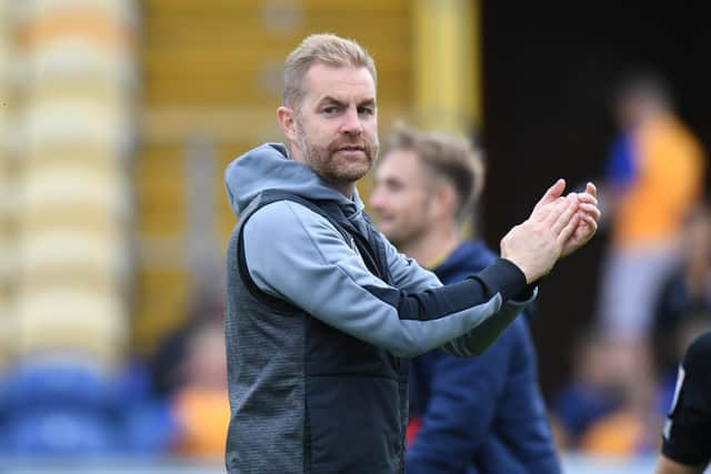 MANSFIELD, ENGLAND - SEPTEMBER 04: Harrogate Town Manager Simon Weaver celebrates their win at the end of the Sky Bet League Two match between Mansfield Town and Harrogate Town at One Call Stadium on September 04, 2021 in Mansfield, England. (Photo by Tony Marshall/Getty Images)