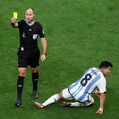 LUSAIL CITY, QATAR - DECEMBER 09: Referee Antonio Mateu shows a yellow card to Jurrien Timber of Netherlands after his challenge on Marcos Acuna of Argentina during the FIFA World Cup Qatar 2022 quarter final match between Netherlands and Argentina at Lusail Stadium on December 09, 2022 in Lusail City, Qatar. (Photo by Elsa/Getty Images)