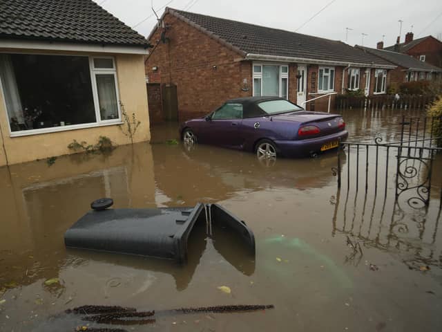 A house surrounded by floodwater in Fishlake, Doncaster, in 2019. PIC: PA