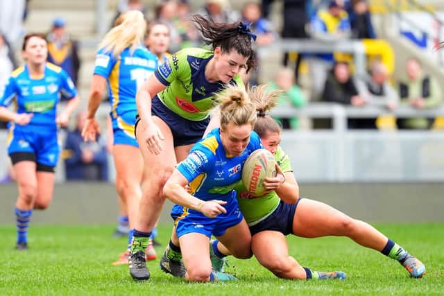 Bethan Dainton of Leeds is tackled by Jasmine Wilson of Warrington and Grace Burnett of Warrington. The two teams meet again at Headingley this Saturday. (Picture: SWPix.com)