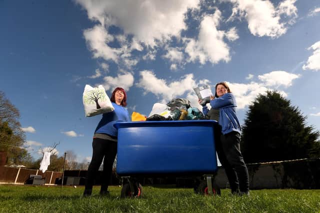 Sally Parkinson (left) and friend Susan Bell sort through donations at The Clothing Bank's base in Brotherton.