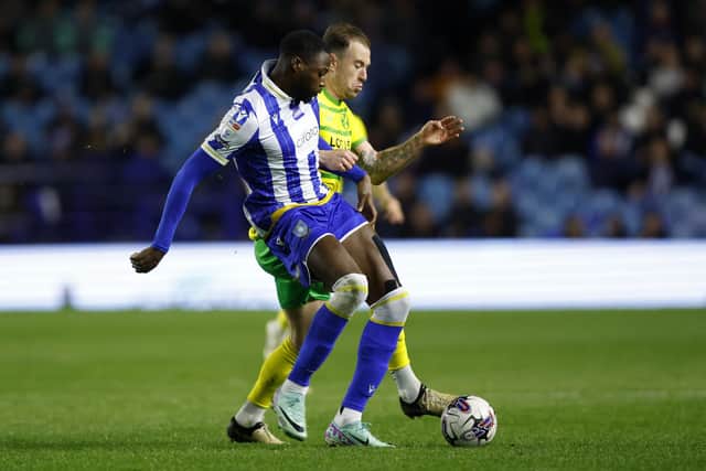 DUEL: Dominic Iorfa battles with Norwich City's Ashley Barnes