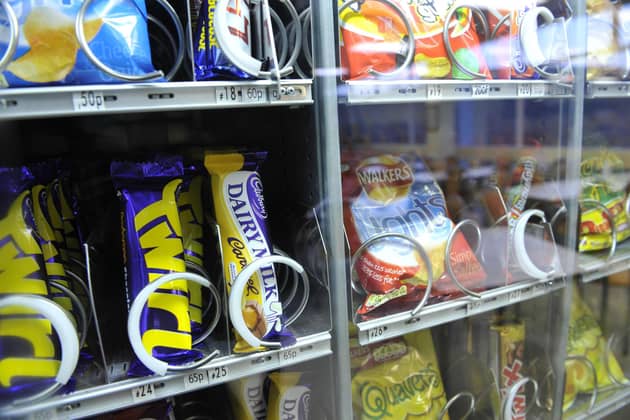 A file photo of a vending machine containing high sugar sweets, chocolate and crisps. PIC: Ben Birchall/PA Wire