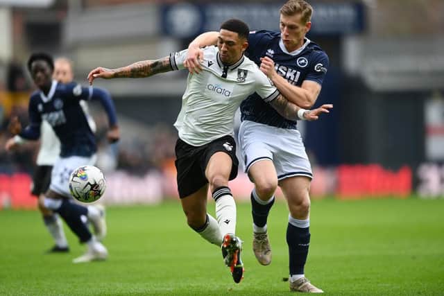 Liam Palmer of Sheffield Wednesday battles for possession with Zian Flemming of Millwall during the Sky Bet Championship match at The Den on February 17. (Photo by Alex Davidson/Getty Images)