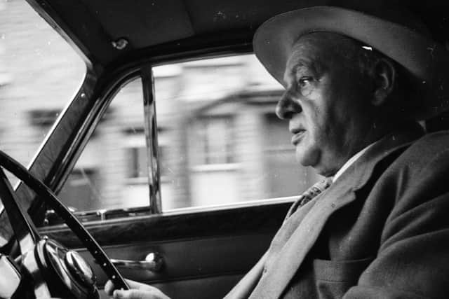 Percy Shaw at the steering-wheel of his car in September 1958. (Pic credit: Peter Laurie / Getty Images)