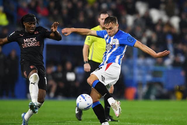 Huddersfield Town midfielder Archie Collins set up the hosts' opener against former side Posh. Picture: Jonathan Gawthorpe