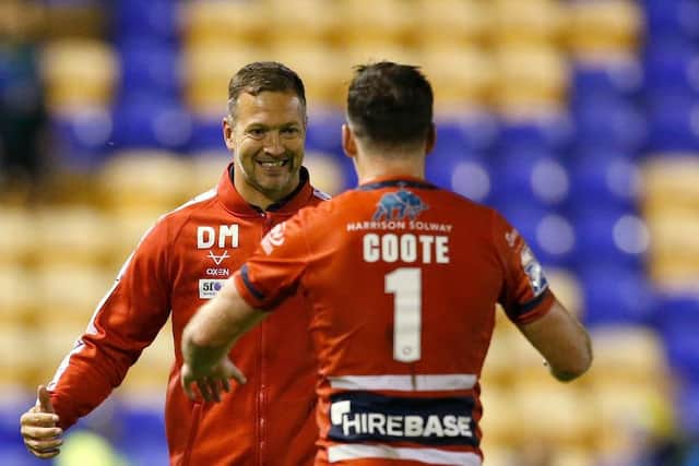 Hull KR head coach Danny McGuire celebrates after the game with Lachlan Coote Picture by Ed Sykes/SWpix.com