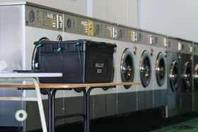 A polling station installed inside a launderette. PIC: Jacob King/PA Wire