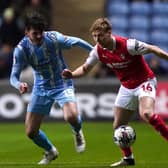 Coventry City's Liam Kitching (left) and Rotherham United's Jamie Lindsay battle for the ball during the Sky Bet Championship match in March. Photo: Bradley Collyer/PA Wire.