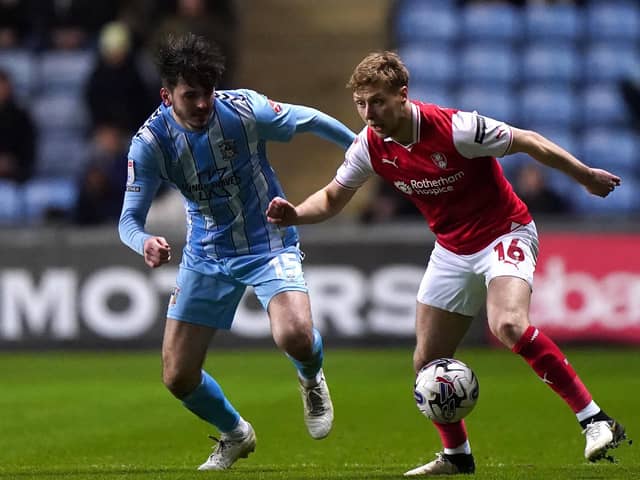 Coventry City's Liam Kitching (left) and Rotherham United's Jamie Lindsay battle for the ball during the Sky Bet Championship match in March. Photo: Bradley Collyer/PA Wire.