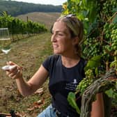 Little Wold Vineyard at South Cave in East Yorkshire.
Alice Maltby with one of their sparkling wines amongst the vines.