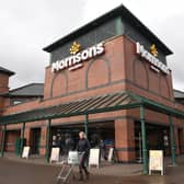 Morrisons has reported improving momentum and positive like-for-like sales after a turbulent period for the Bradford-based chain.