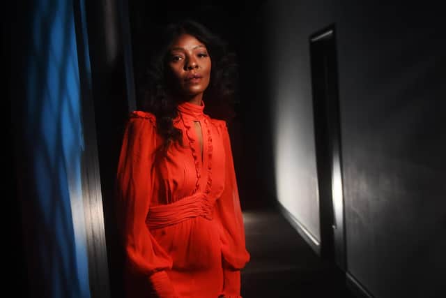 Model and singer Pearl Natasha wears an orange silk ME+EM dress at the Fling fashion rental showroom at Mabgate Mills In Leeds. Picture by Yorkshire Post photographer Simon Hulme